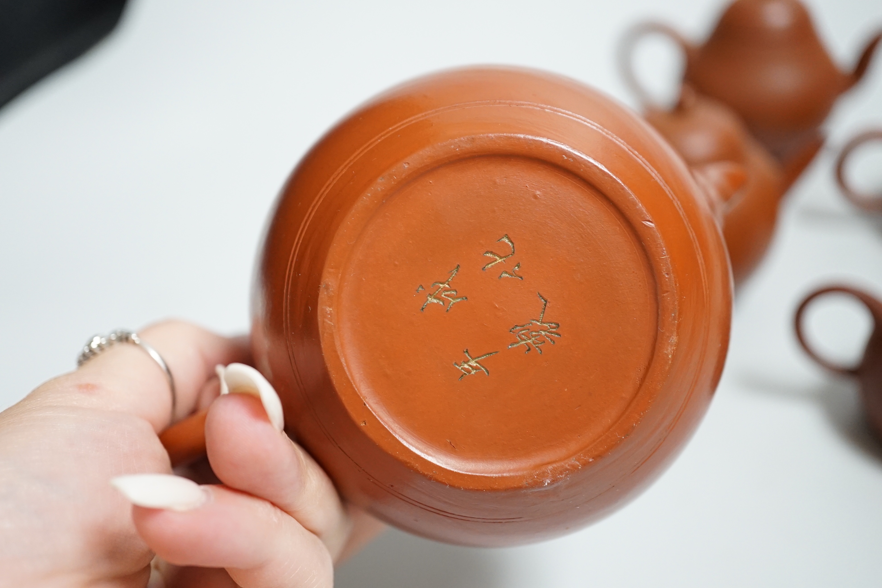 Five Chinese Yixing small teapots, probably 19th/20th century, one cover lacking